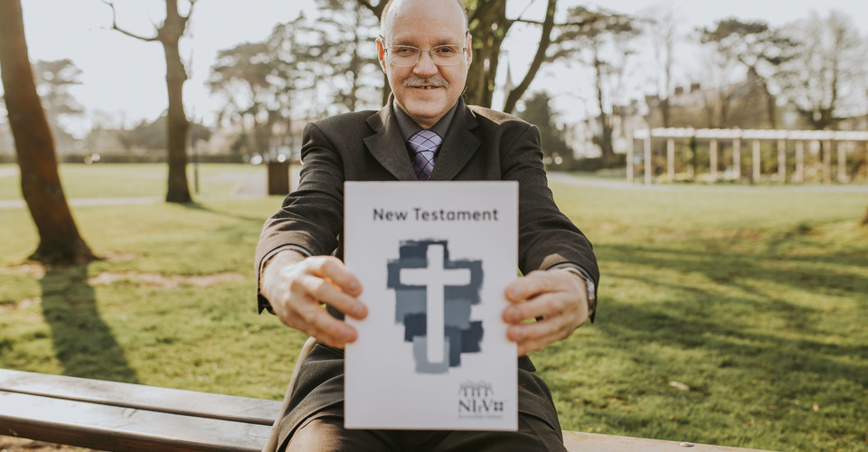 Cameron holding up the Accessible Bible